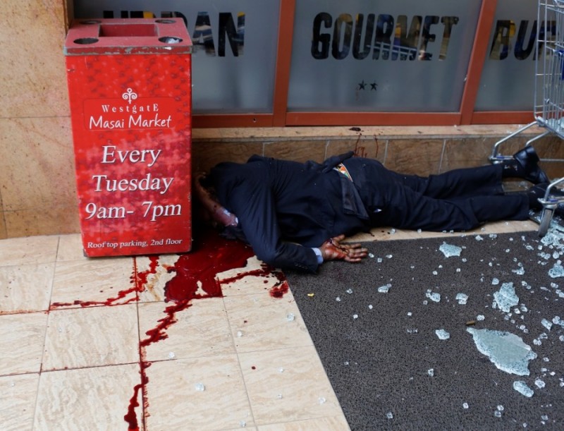 A dead man lies at the entrance of the Westgate Shopping Centre in Nairobi September 21, 2013.